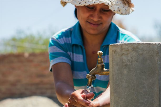 Water For People - Woman fetching water